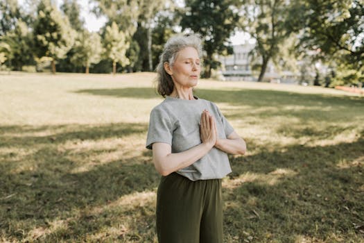 person meditating in nature